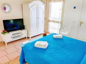 TV a/nebo společenská místnost v ubytování B&B Casa De Mare