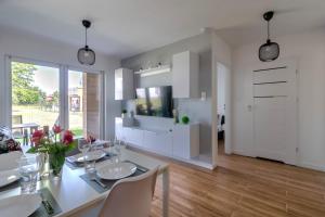 Telewizja i/lub zestaw kina domowego w obiekcie Apartamenty Kuracyjna