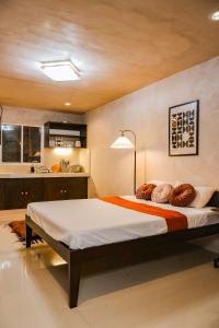 a bedroom with a large bed in a room at DMall Central Stn 2 Near Beach in Boracay