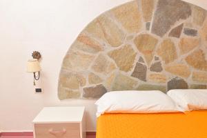 Postel nebo postele na pokoji v ubytování Resort Punto Azzurro