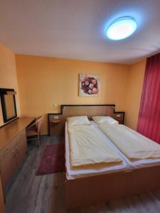 Postel nebo postele na pokoji v ubytování Haus Kim - Apartments