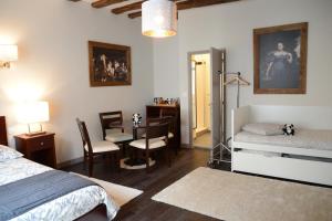 Säng eller sängar i ett rum på Maison du chatelain