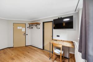 TV a/nebo společenská místnost v ubytování Hotel Comenius