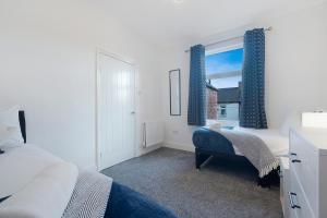 Voodi või voodid majutusasutuse Spacious 4BR on Leafield Rd toas