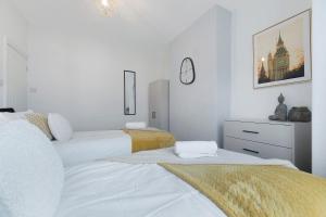 Voodi või voodid majutusasutuse Spacious 4BR on Leafield Rd toas