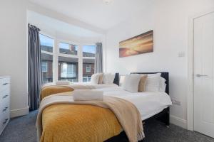 Voodi või voodid majutusasutuse Spacious 4BR on Leafield Rd toas