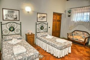 Ένα ή περισσότερα κρεβάτια σε δωμάτιο στο Niccoli's Holiday Home In Tuscany