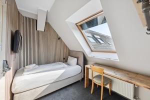 Postel nebo postele na pokoji v ubytování Hotel Comenius