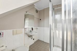 Koupelna v ubytování Hotel Comenius