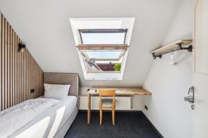 Postel nebo postele na pokoji v ubytování Hotel Comenius