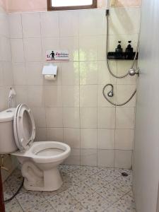 a bathroom with a toilet and a shower at Khaosok gallery & camp in Ban Khong Hua Kwang