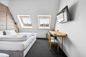 Postel nebo postele na pokoji v ubytování Hotel Comenius