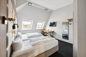 Postel nebo postele na pokoji v ubytování Hotel Comenius