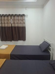 Postel nebo postele na pokoji v ubytování Jayshree Cottages