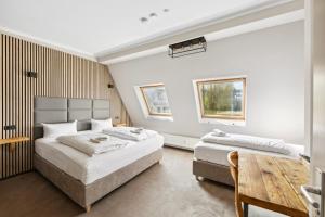 Postel nebo postele na pokoji v ubytování Hotel Comenius + 37 fotografií