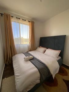 Ένα ή περισσότερα κρεβάτια σε δωμάτιο στο Kjay's Homes