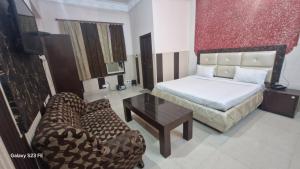 Ένα ή περισσότερα κρεβάτια σε δωμάτιο στο Hotel Asia Palace