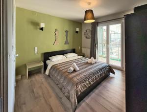 a bedroom with a bed with two pillows on it at SkyView Paralia in Paralia Katerinis
