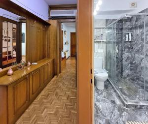a bathroom with a shower and a toilet at SkyView Paralia in Paralia Katerinis +64 photos