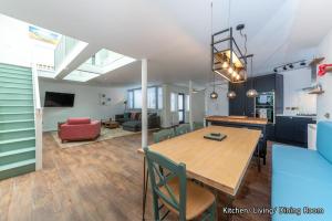 a kitchen and living room with a table and chairs at The Lost Lobster in North Berwick