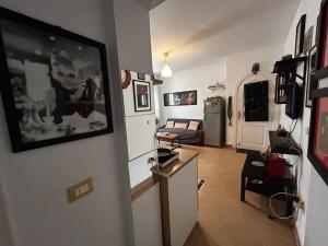 a living room with a refrigerator and a room with a couch at lavista cozy chalet one bedroom in Ain Sokhna