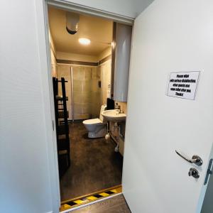 a bathroom with a toilet and a sink at Stekhuset B&B in Kalmar +46 photos