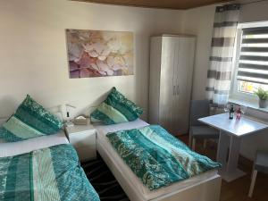 Postel nebo postele na pokoji v ubytování Gästezimmer Mia