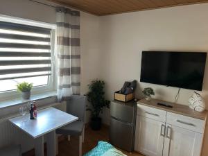 TV a/nebo společenská místnost v ubytování Gästezimmer Mia