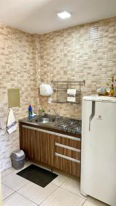 Dapur atau dapur kecil di Apartamento central, completo, com ar condicionado, cozinha e WIFI