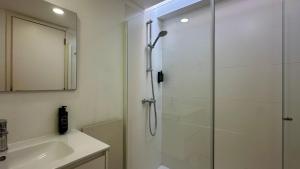 a bathroom with a shower and a sink at Galo - Private Pool - 8 Guests - Albufeira in Albufeira