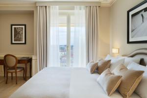 Postel nebo postele na pokoji v ubytování Grand Hotel Imperiale