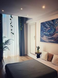 a bedroom with a large bed and a window at Sottolavolta in Lecce