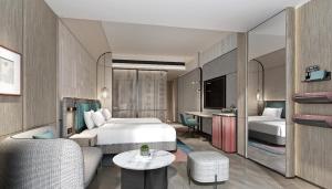 um quarto de hotel com uma cama e uma sala de estar em EVEN Hotel Chengdu High-Tech Zone, an IHG Hotel em Chengdu