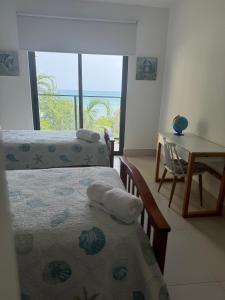 Postel nebo postele na pokoji v ubytování Charming Zen-style Beach apartment at Punta Caelo