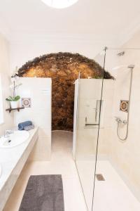 a bathroom with a shower and a sink at Villa Sol in Charco del Palo +29 photos