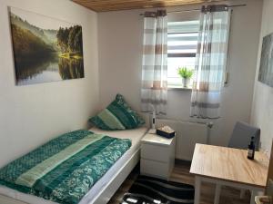 Postel nebo postele na pokoji v ubytování Gästezimmer Mia