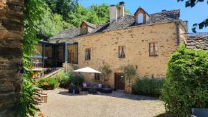 an external view of a house with a patio at La Ferme des Andes in Quins