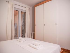 Postel nebo postele na pokoji v ubytování Apartment Jelka- center of Hvar town