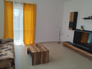 a living room with a couch and a coffee table at Rocky in Razvala