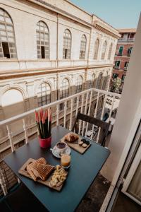 a table with food on top of a balcony at Boutique Luxury Suite in Naples