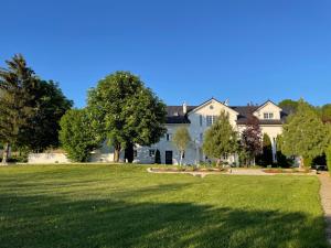 a large white house with a large yard at Wohnen am Penzkofergut in Feichten +22 photos
