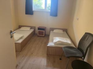 Postel nebo postele na pokoji v ubytování Manuela Ifjúsági Hotel