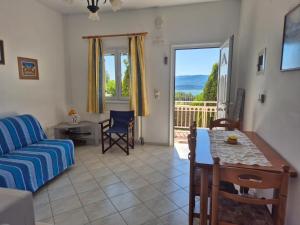 a living room with a couch and a table at Apartments Marina House in Fársa