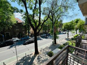 a view of a street with cars parked on the road at Floreasca apartment in Bucharest