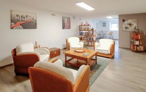 a living room with couches and chairs and a table at 2 Bedroom Cozy Home In Tabre in Tabre