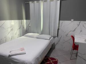 Postel nebo postele na pokoji v ubytování Hotel e Pousada REQUINTTE