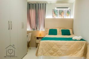 Ένα ή περισσότερα κρεβάτια σε δωμάτιο στο Apt Completo Próximo da Praia de Atalaia +47 φωτογραφίες