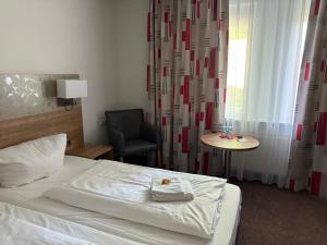 Postel nebo postele na pokoji v ubytování Hotel Schweizerblick