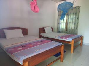 Voodi või voodid majutusasutuse Hotel Sea Shadow toas