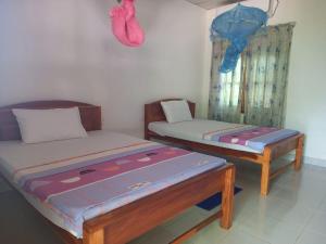 Voodi või voodid majutusasutuse Hotel Sea Shadow toas